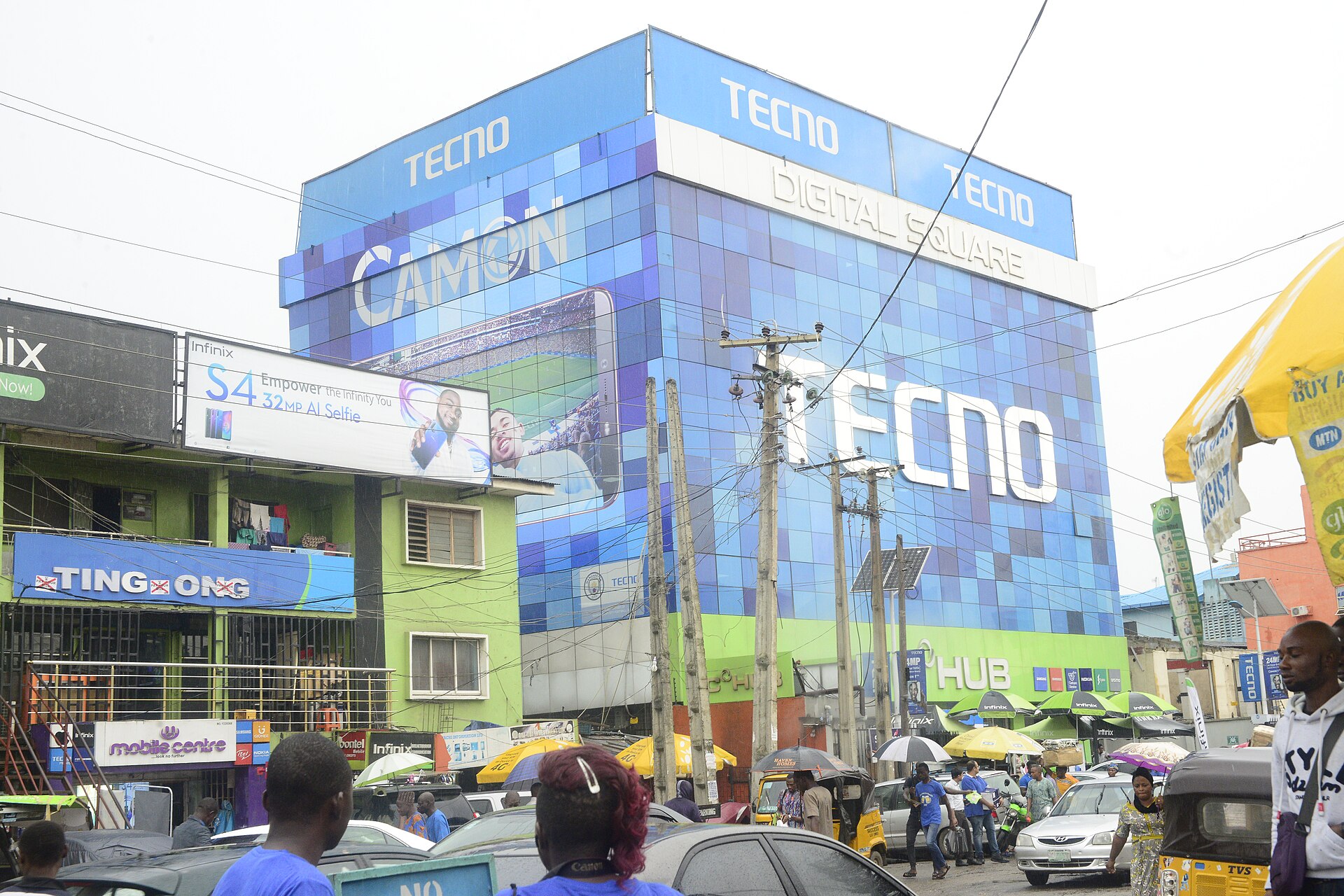 Digital Square tower and phone shops on a busy road in Computer Village, Ikeja